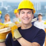Smiling Construction worker man. Architecture background.