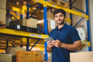 Male warehouse worker portrait in warehouse storage